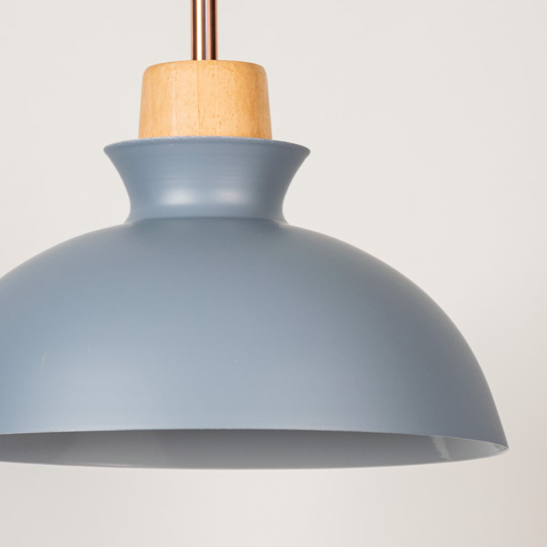 Closeup of grey dome pendant ceiling light with wooden accent showing matte finish for modern kitchen dining and cafe lighting design.