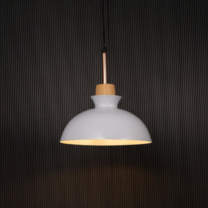 White dome pendant ceiling light with wooden accent illuminated on back background for dining room cafe and modern interior lighting.