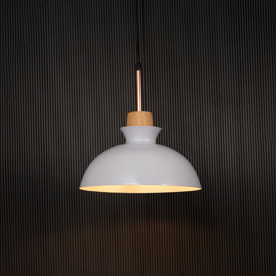White dome pendant ceiling light with wooden accent illuminated on back background for dining room cafe and modern interior lighting.