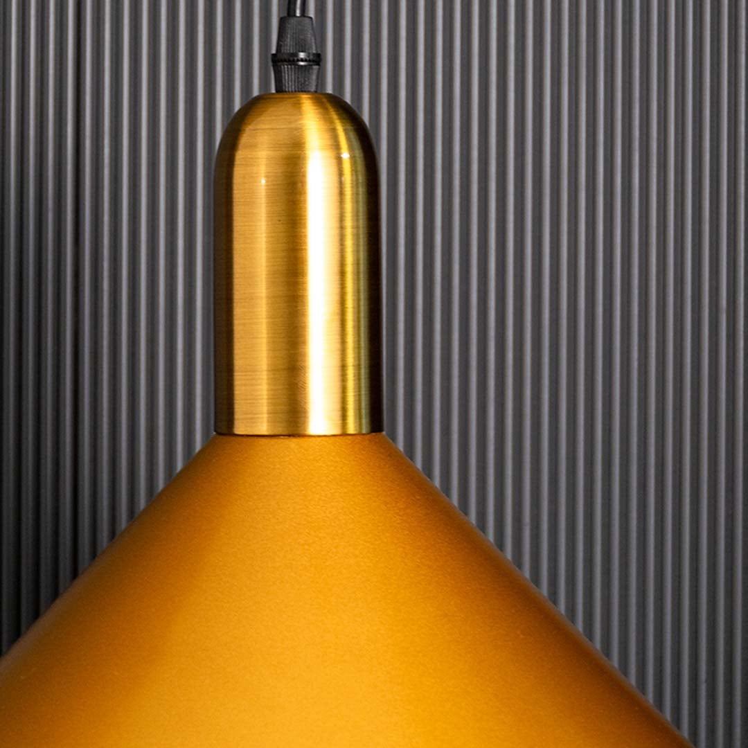 A detailed close view of the gold cone pendant light highlighting its polished metal finish and refined geometric shape suited for stylish decor.