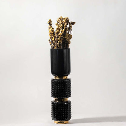 Natural yellow dried flowers held in hand against a soft room setting adding warm rustic texture to modern home decor.