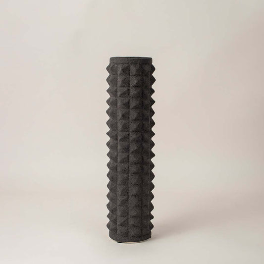 Elegant black ceramic vase with raised diamond texture displayed on white background for contemporary interior decor.
