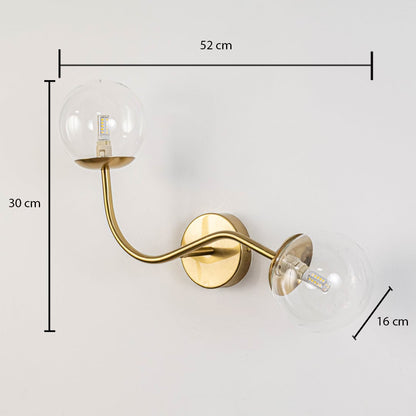 Clear glass globe double arm wall lamp with gold base dimension 30 cm height 52 cm width 16 cm depth for living room decor.