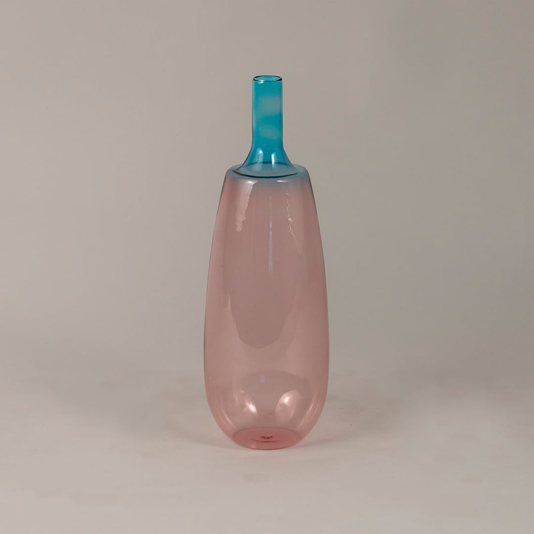 Gradient pink blue glass vase with glossy surface suitable for minimal home or studio interior decor.