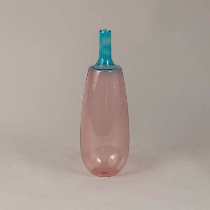 Gradient pink blue glass vase with glossy surface suitable for minimal home or studio interior decor.