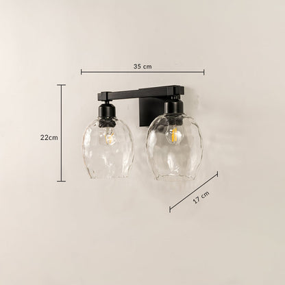 Black double wall light with hammered glass shades measuring 22 cm height 35 cm width and 17 cm depth shown clearly for accurate placement.