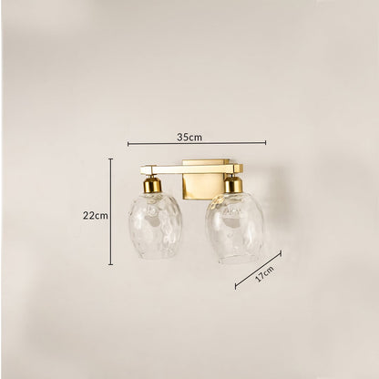 Brushed gold double wall light with hammered glass shades measuring 22 cm height 35 cm width and 17 cm depth shown for accurate placement.