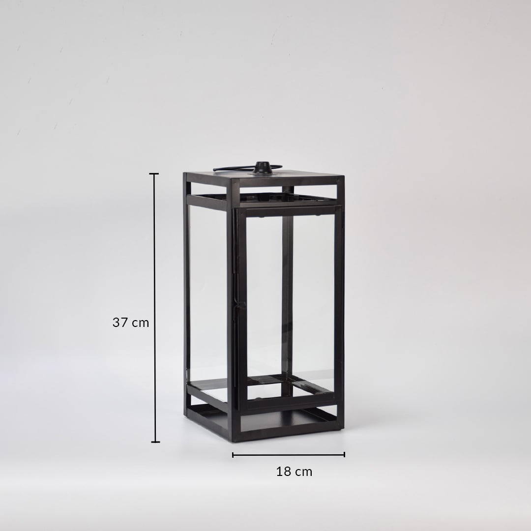 Black metal lantern showing 37 cm height and 18 cm width dimensions suitable for tabletop floor or porch decorative lighting placement.