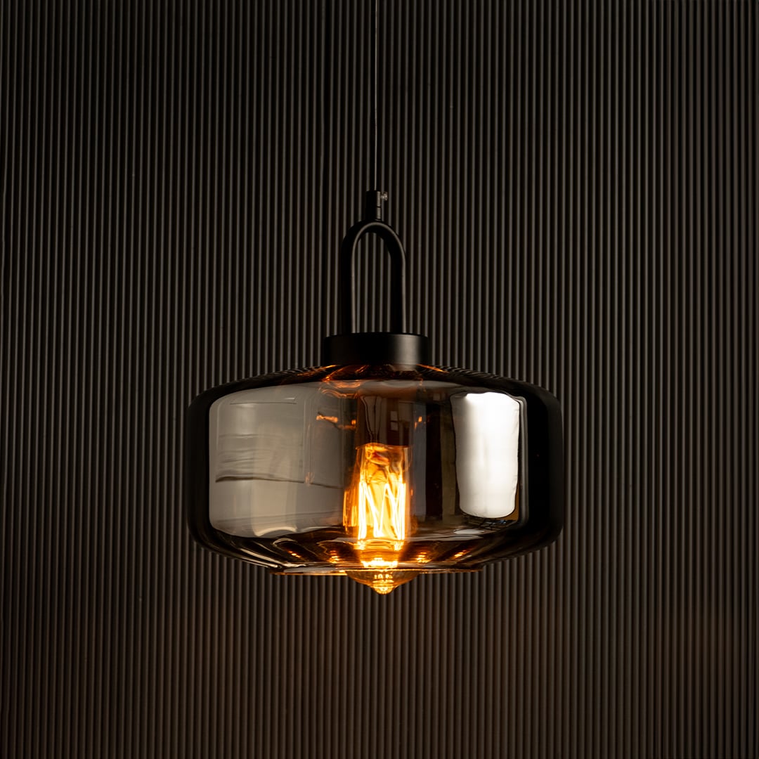 Smoky grey glass pendant light with warm LED illumination perfect for modern home lighting and interior decor enhancing contemporary ceiling lamp design.