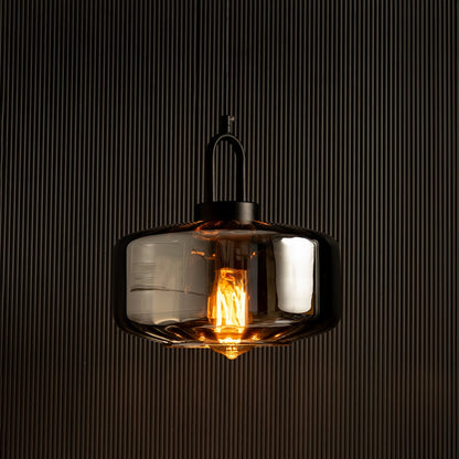 Smoky grey glass pendant light with warm LED illumination perfect for modern home lighting and interior decor enhancing contemporary ceiling lamp design.