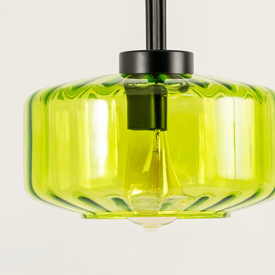 Green glass pendant light closeup highlighting textured glass finish and premium modern decorative lighting design.