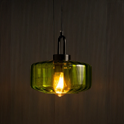 Green glass pendant light with warm LED glow ideal for kitchen island lighting and modern home interiors offering a vibrant decorative hanging light accent.