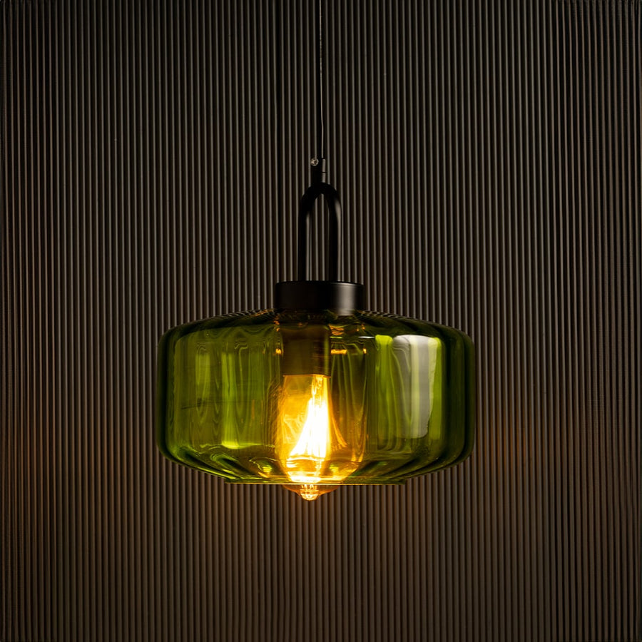 Green glass pendant light with warm LED glow ideal for kitchen island lighting and modern home interiors offering a vibrant decorative hanging light accent.