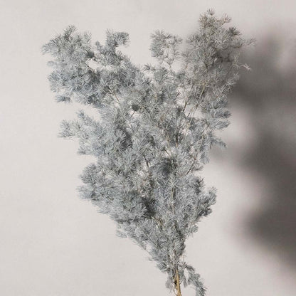 Detailed closeup of artificial foliage in icy grey white tones with soft branches ideal for DIY vase decor and interior styling.