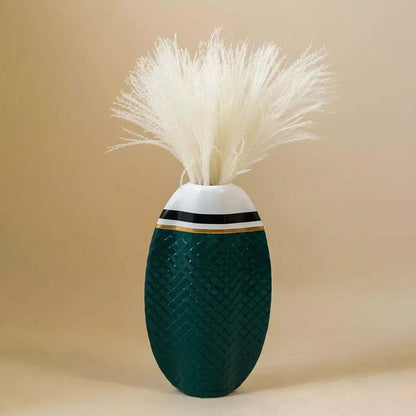 Soft fluffy white pampas grass stems arranged in a bunch on clean white background decorative dried flower accent piece.