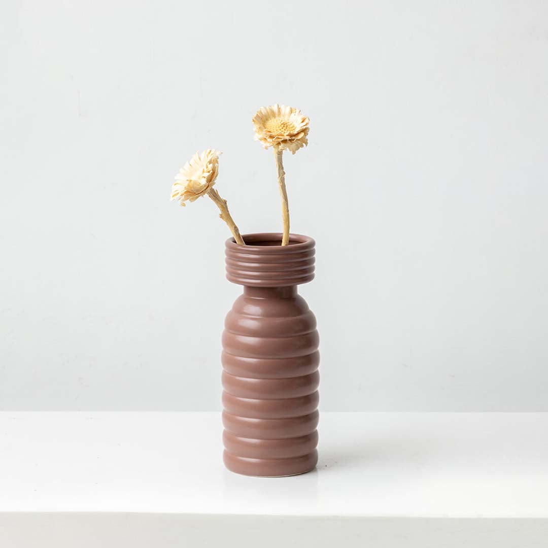 Natural dried wooden flower stem in soft beige styled for warm home decor adding rustic texture and organic charm.