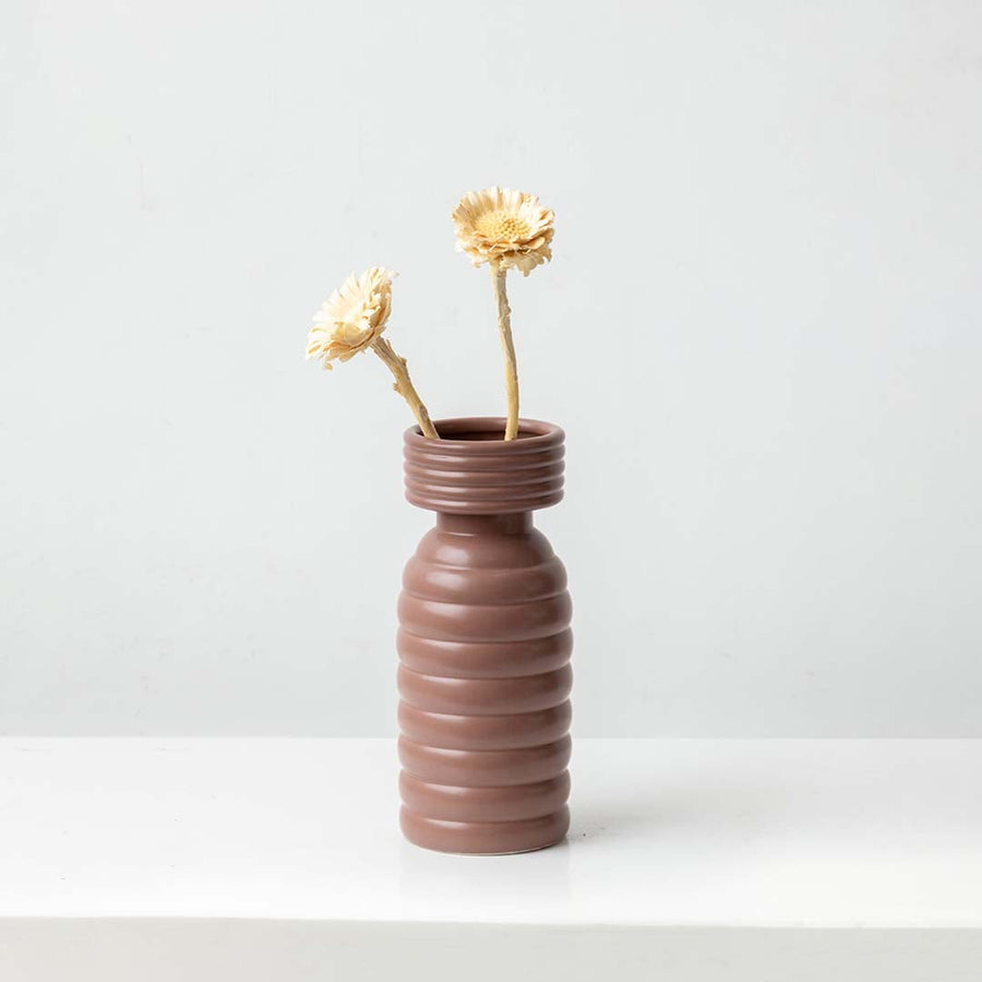 Natural dried wooden flower stem in soft beige styled for warm home decor adding rustic texture and organic charm.