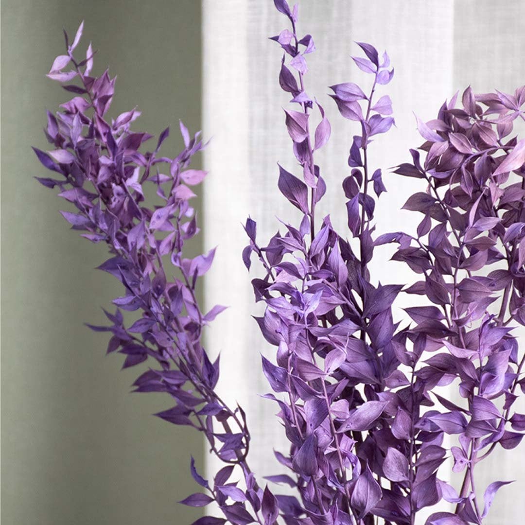 Purple eucalyptus bunch closeup highlighting dried leaf details and premium preserved material for vase arrangements.