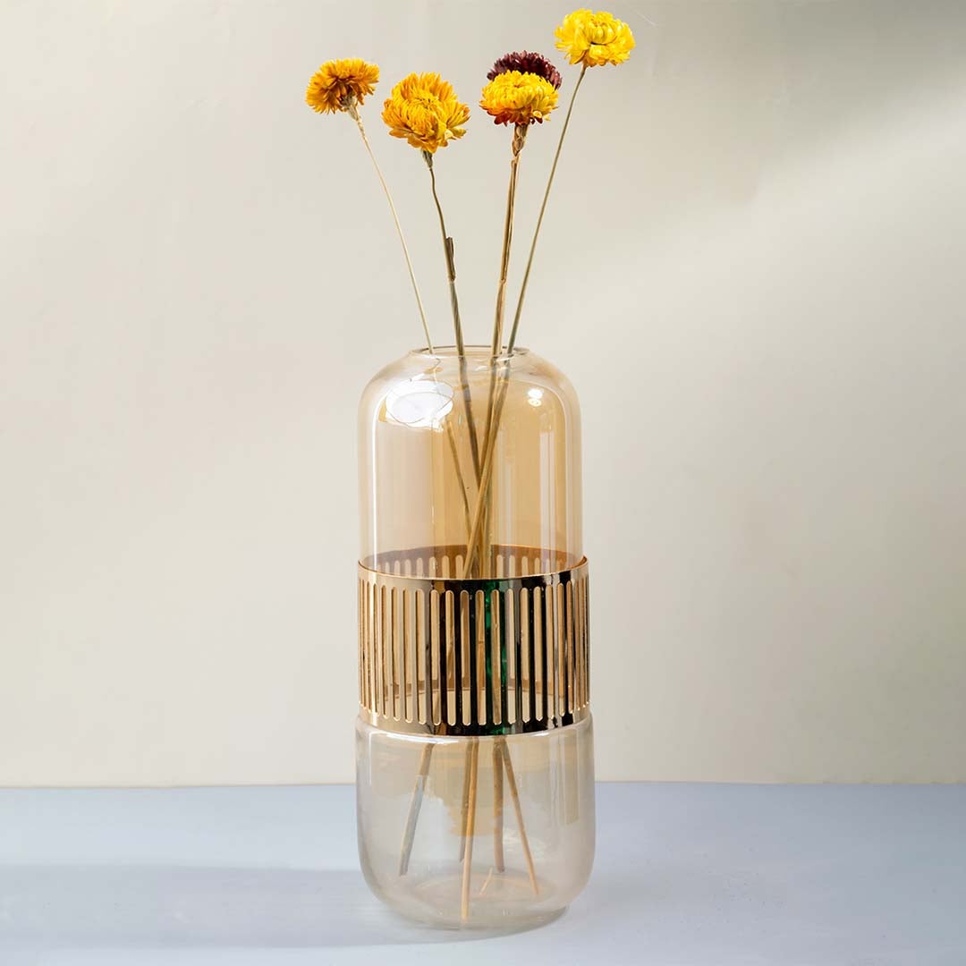 Bright yellow dried daisy stem styled in a warm modern room adding a cheerful natural touch to contemporary home decor.