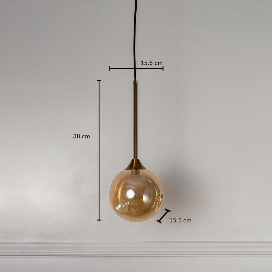 Amber glass globe pendant lamp with brass rod showing 38cm height and 15.5cm width for accurate size measurement.