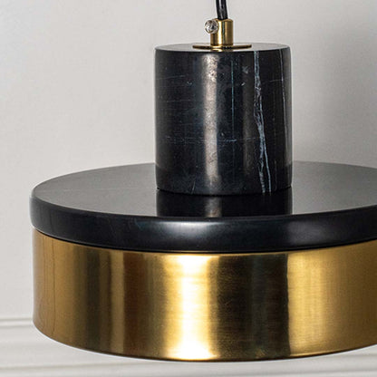 Closeup of black and golden round pendant light with modern finish stylish ceiling lamp for luxury home interior lighting decor.