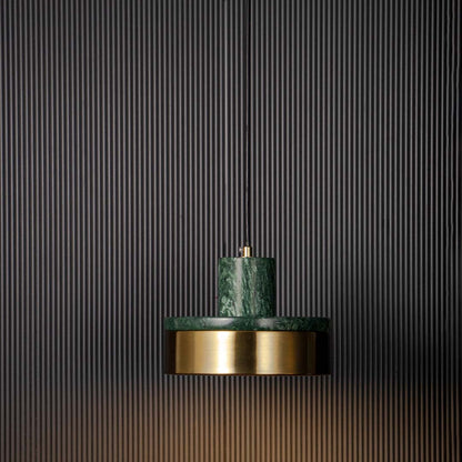 Luxury pendant lamp with green marble and golden base shade glowing warmly displayed on black background for modern decor.