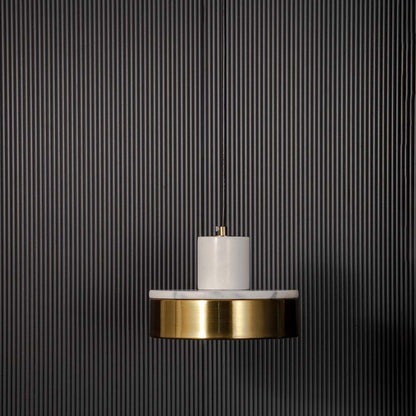 Elegant pendant light with white marble detail and gold base shade displayed off on black background for modern interiors.