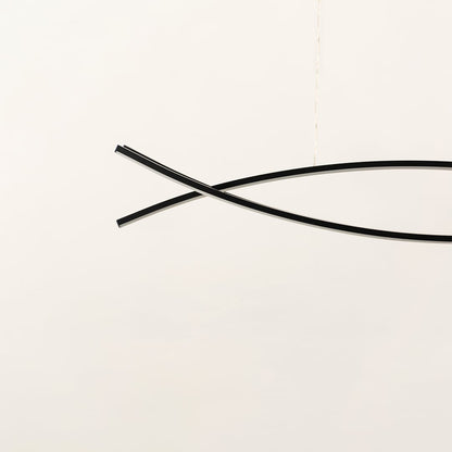 A sleek black linear chandelier with two intersecting curved bars displayed on a clean white backdrop with the light off offering minimal refined modern décor.
