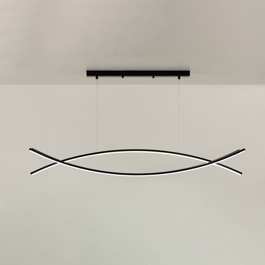 A sleek black linear pendant with intersecting curved bars suspended against a plain white wall with the light off enhancing minimal modern décor.