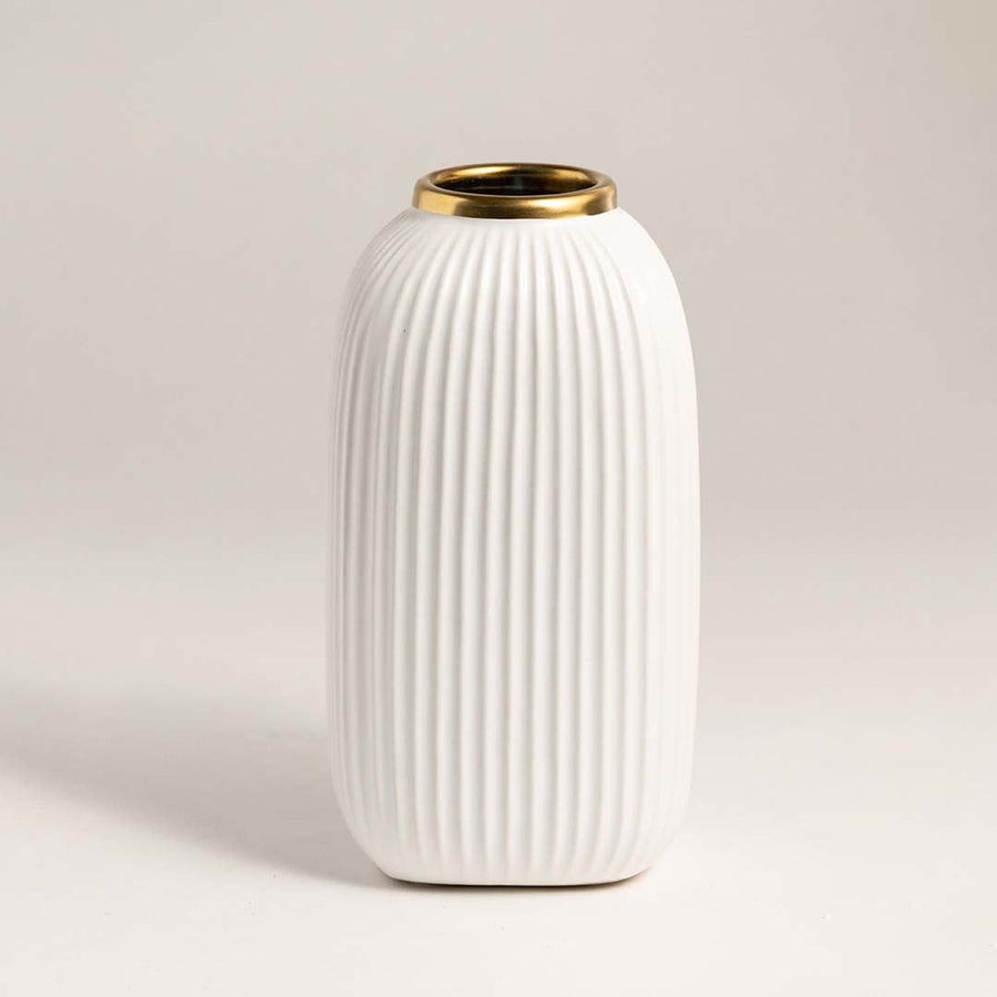 Detailed macro shot of the ceramic vase’s ribbed finish and metallic rim showing premium craftsmanship and smooth finish.