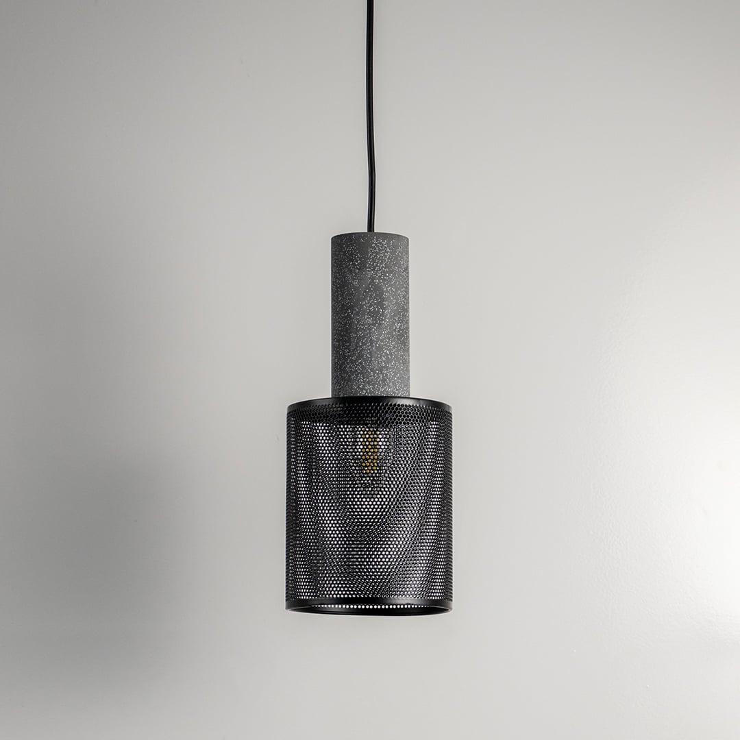 Arlo Mesh pendant light photographed on a plain black background emphasizing clean cylindrical structure.
