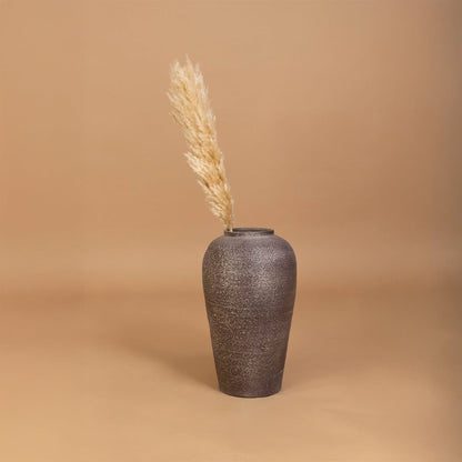 Brown rustic tall vase placed in a curated home setting enhancing consoles shelves and living spaces with natural earthy decorative appeal.