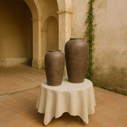 Brown rustic tall decorative vase styled in a warm modern room adding earthy artistic decor to living rooms hallways and contemporary interior spaces.