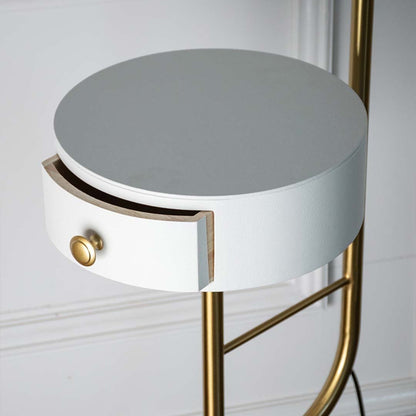 Closeup view of the elegant green floor lamp showcasing its unique design and gold accent.
