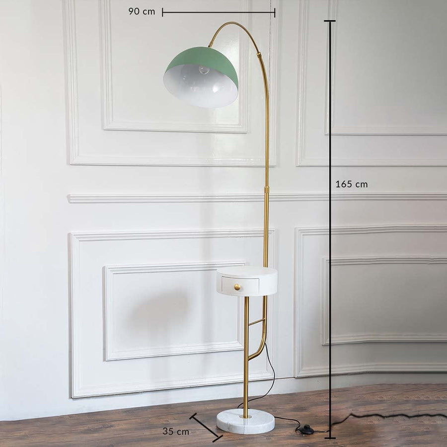 Green floor lamp with measurements of 90 cm height and 35 cm base styled in a minimalist living room.