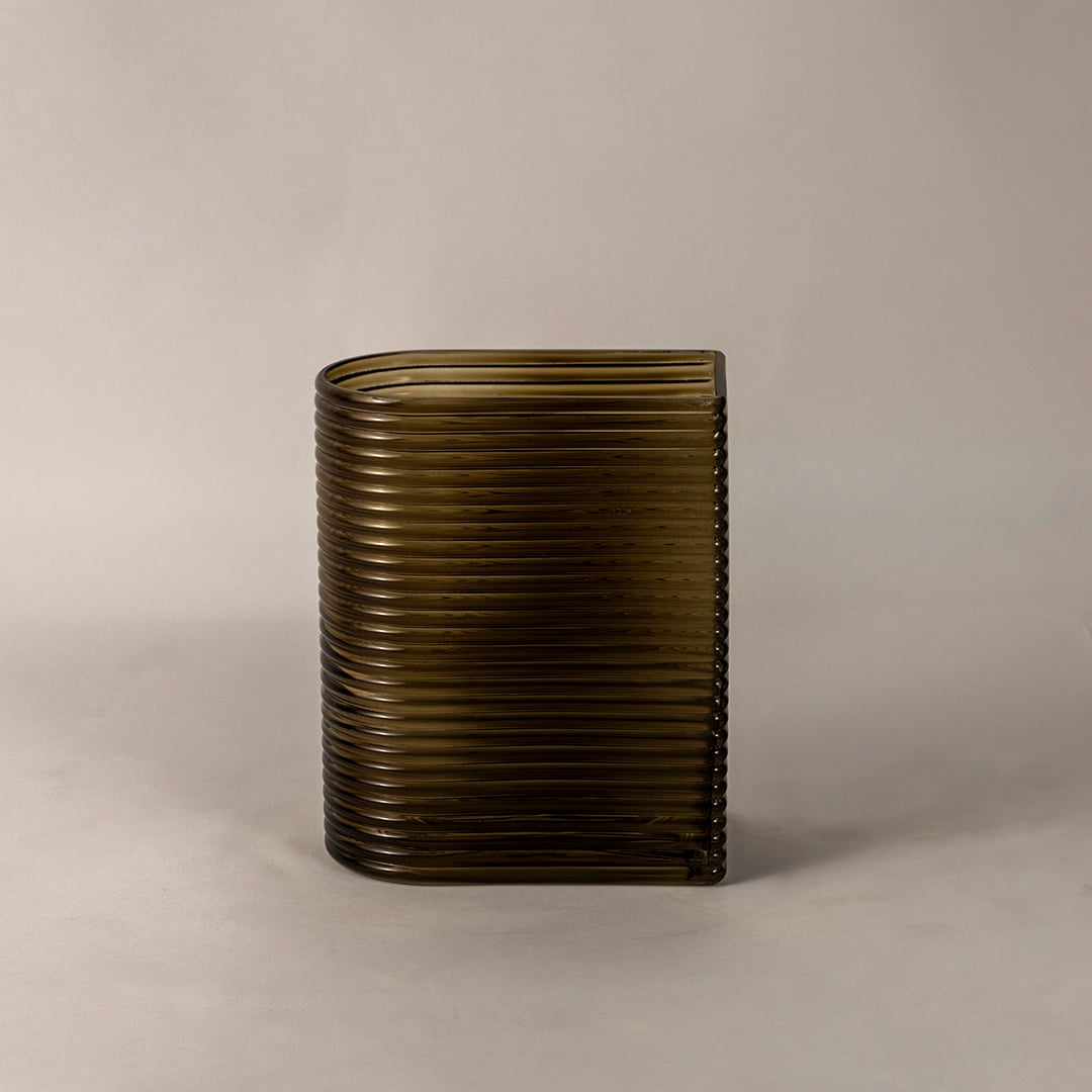 Handcrafted ribbed glass vase in smoke brown rectangular curved form decorative modern accessory light on white background styling.