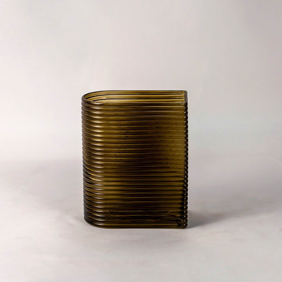 Elegant ribbed glass vase smoke brown tone rectangular curved shape modern style light on white background for living room decor.