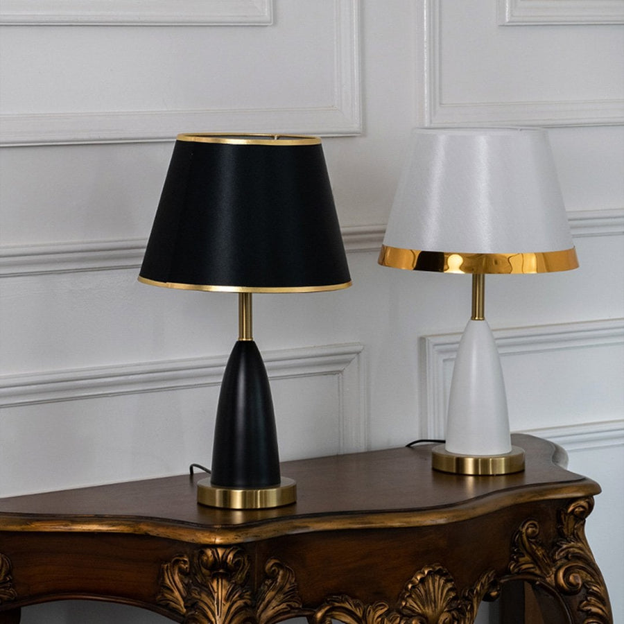 Grouped black and gold table lamp styled with similar lighting pieces creating coordinated elegant home decor table lamp.