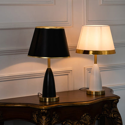Grouped black and gold table lamp styled with similar lighting pieces creating coordinated elegant home decor table lamp.