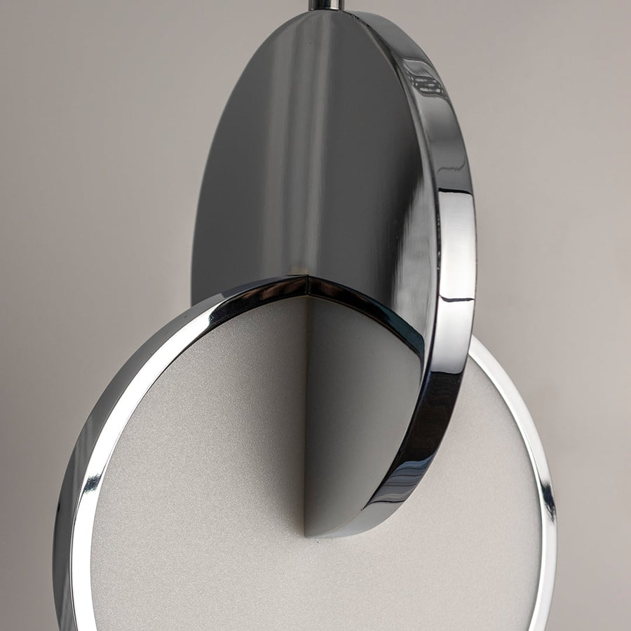 Closeup of luna disc pendant light turned off showing elegant black and chrome finish with circular frosted diffuser design.