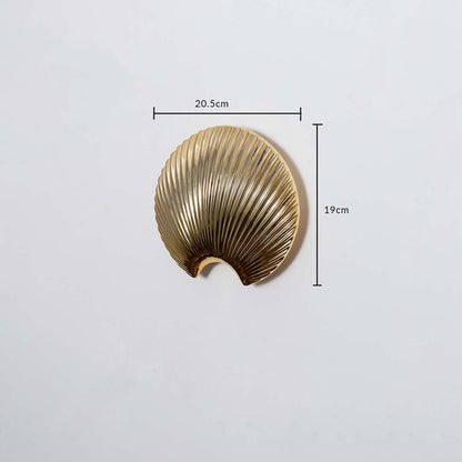 A gold shell decor accent displayed with measurements showing 20.5 cm width and 19 cm height offering a clear understanding of product size.
