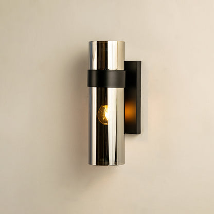 Wall light with chrome cylindrical body and black mount ideal for modern bedroom or hallway wall decor placement on clean background.