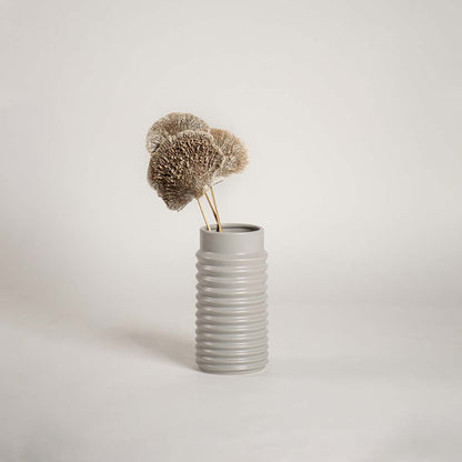Light grey ribbed ceramic vase displayed on a clean white background ideal for modern home decor and minimal elegant interior styling.