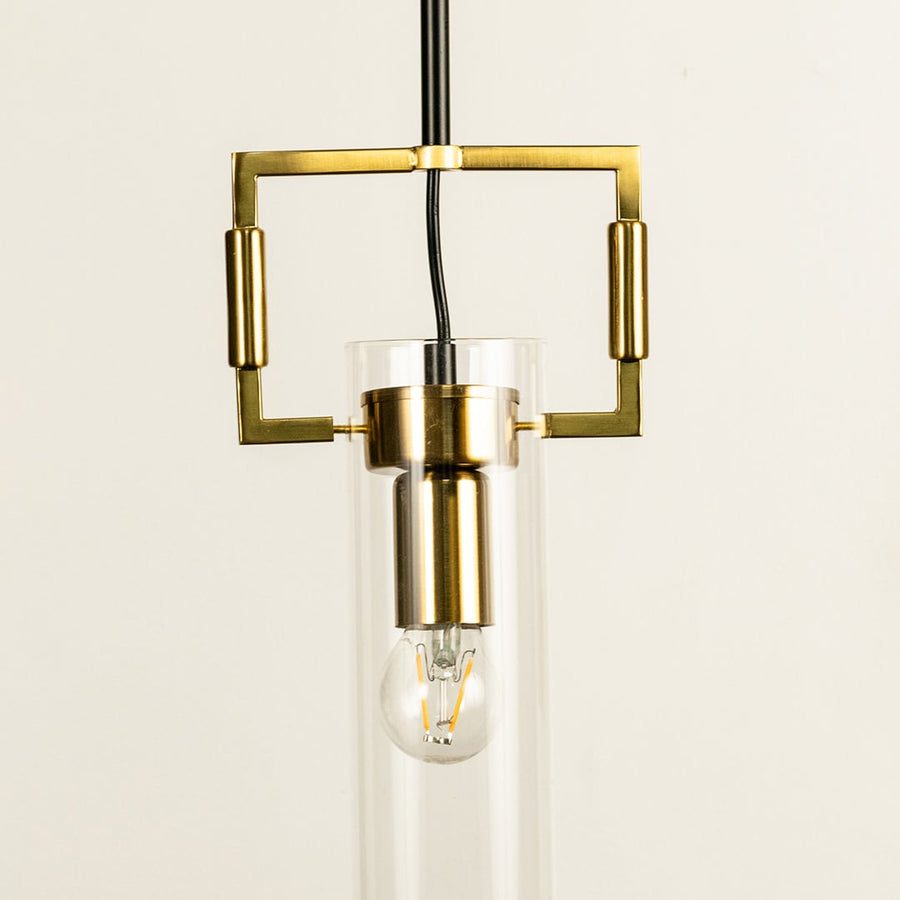 A gold geometric pendant light with a square frame and glass cylinder ideal for modern LED chandelier décor and stylish contemporary interior lighting.