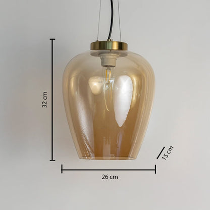Amber glass pendant light measuring 26 cm wide and 32 cm tall featuring a brass mount and sleek glass body.