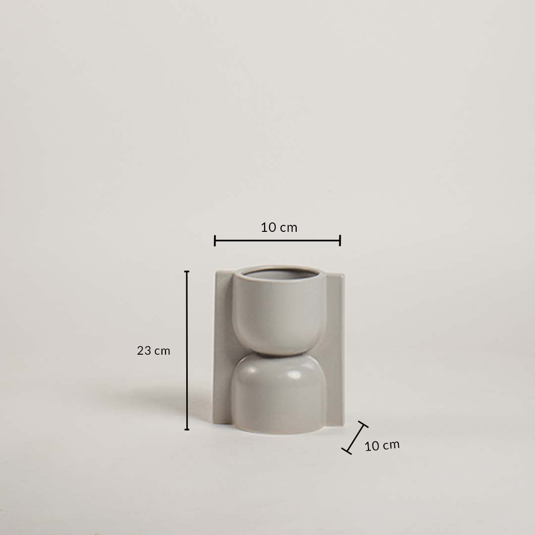 Light grey geometric ceramic vase with 23 cm height and 10 cm width shown clearly for accurate home decor size reference and planning.