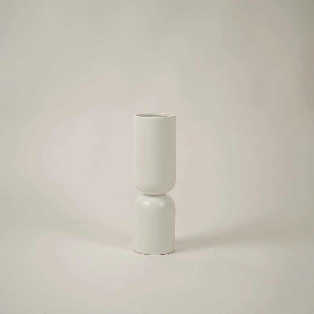 Contemporary white ceramic vase on a soft white background ideal for stylish modern home decor.