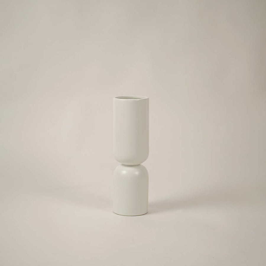 Contemporary white ceramic vase on a soft white background ideal for stylish modern home decor.