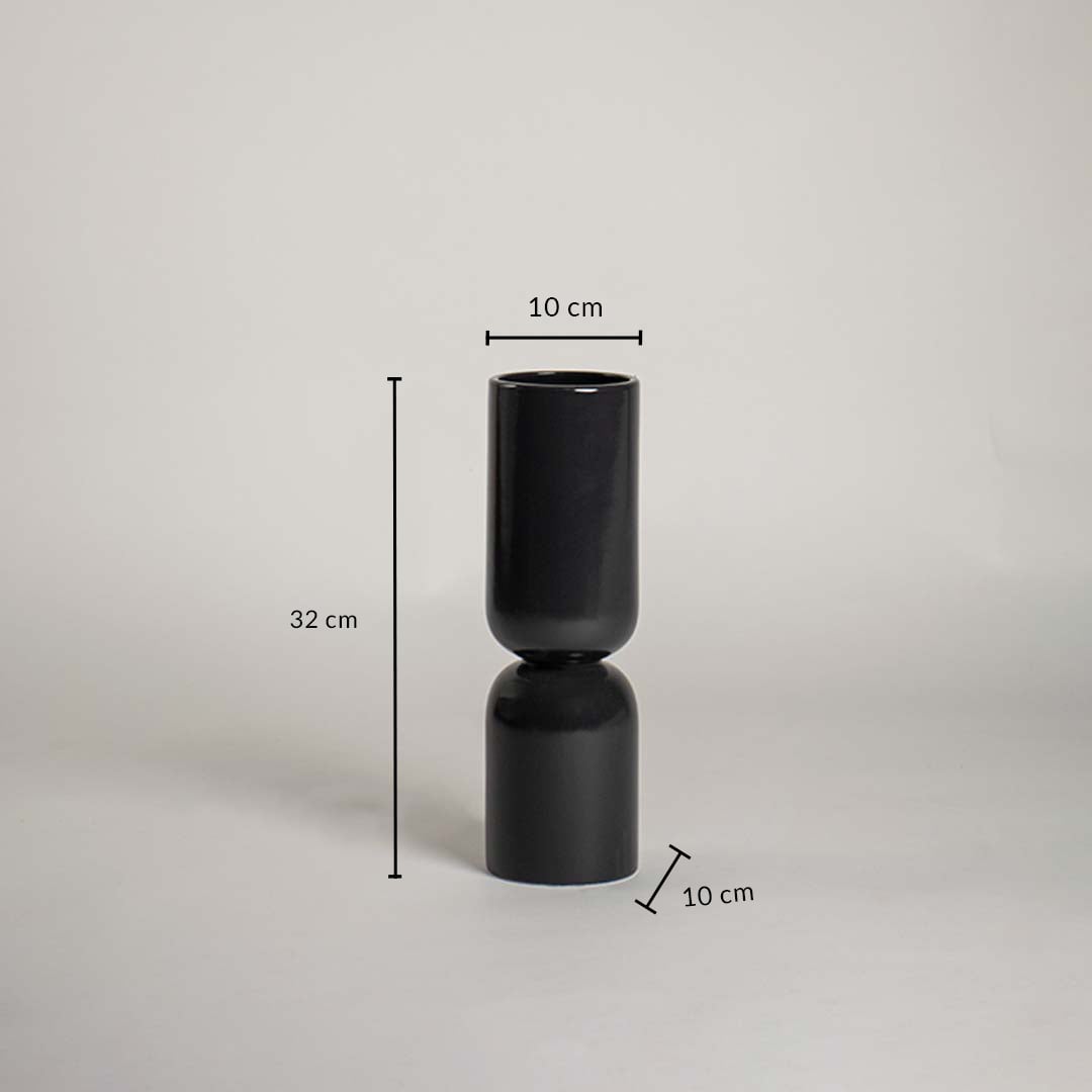 Black ceramic vase with 32 cm height and 10 cm width shown clearly for accurate interior decor size reference and planning.