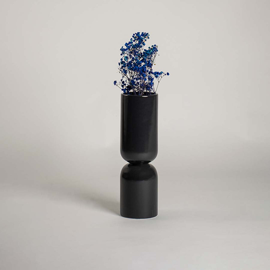 Black double form ceramic vase displayed on a clean white background ideal for modern home decor and stylish contemporary interiors.